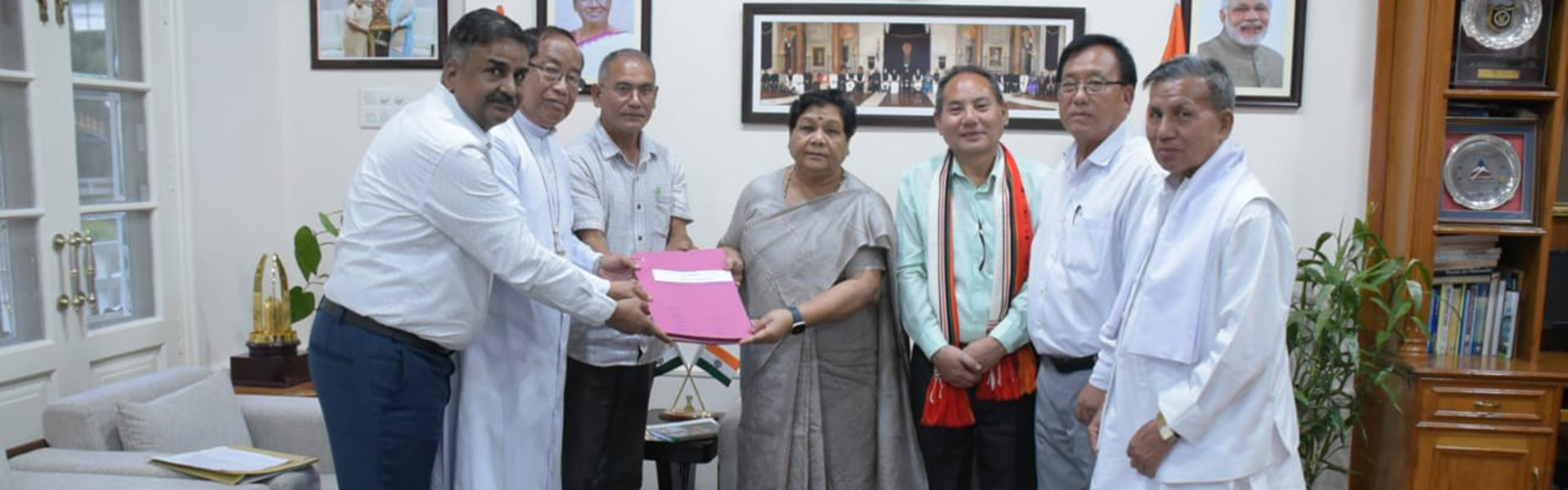 Members of the Interfaith Forum for Peace and Harmony, Manipur presenting their memorandum to the Governor of Manipur, Anusuiya Uikey